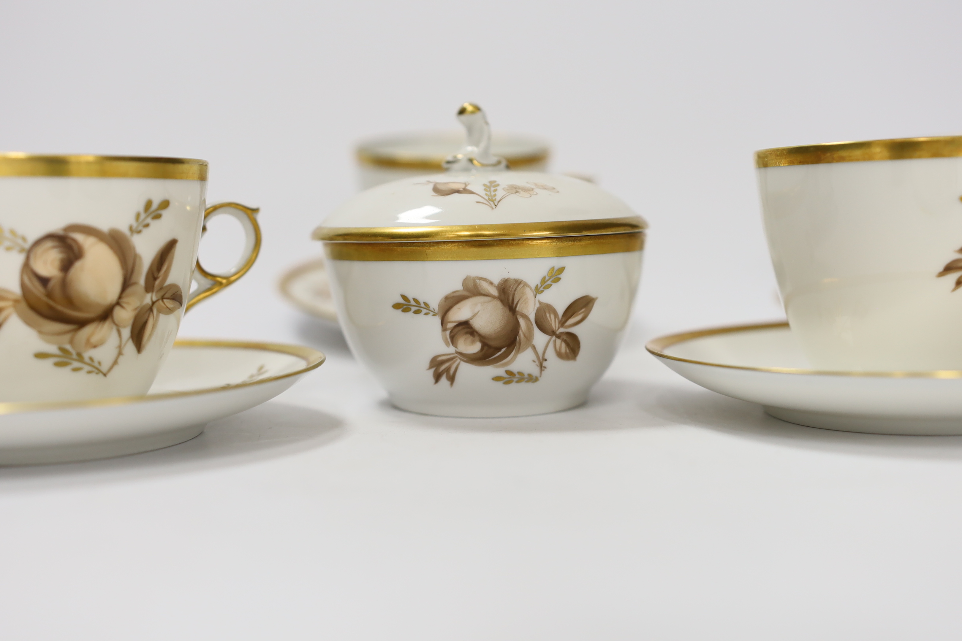 A Royal Copenhagen part coffee set comprising six cups and saucers and a jar and cover, largest 12.5cm in diameter